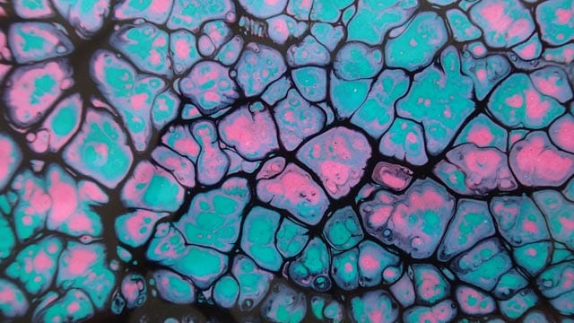 Black swipe using pink and blue iridescent paints.