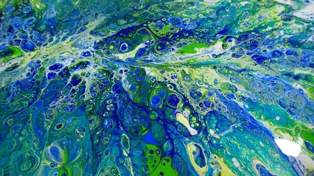 Acrylic pouring video. Painting on a large ceramic tile using blues, green and white. The paint is blown into the design with a straw. I love to watch the video to see this come together out of the paint.