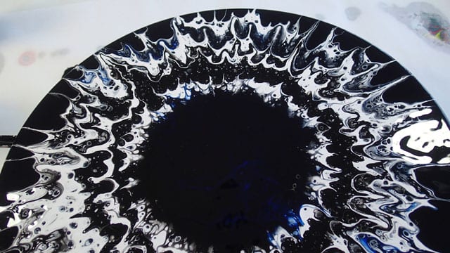How to create simple spin art abstract paintings with acrylic pouring, and a turntable. Make stunning paintings that look like an eye.