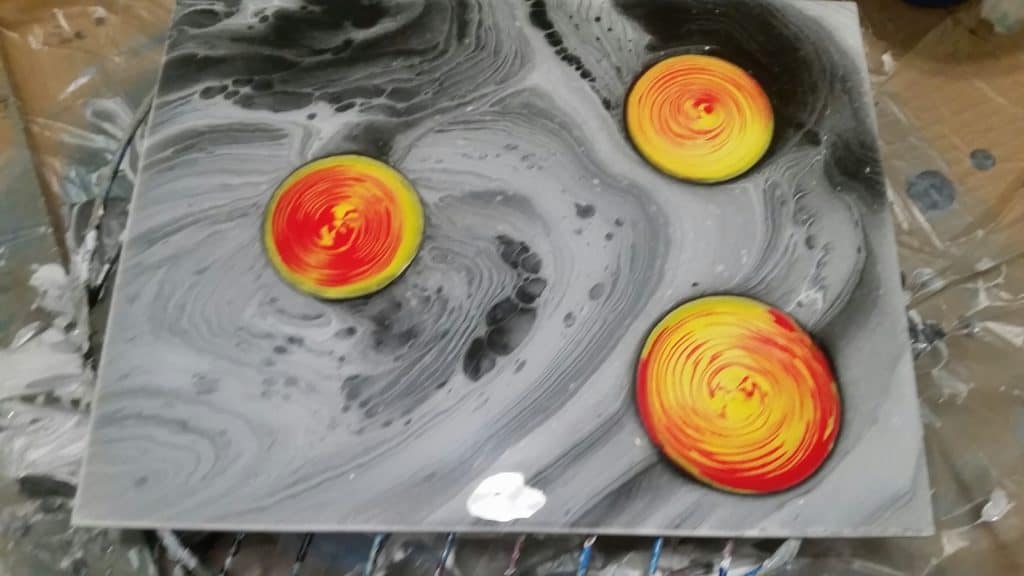 Black and white with orange acrylic pour